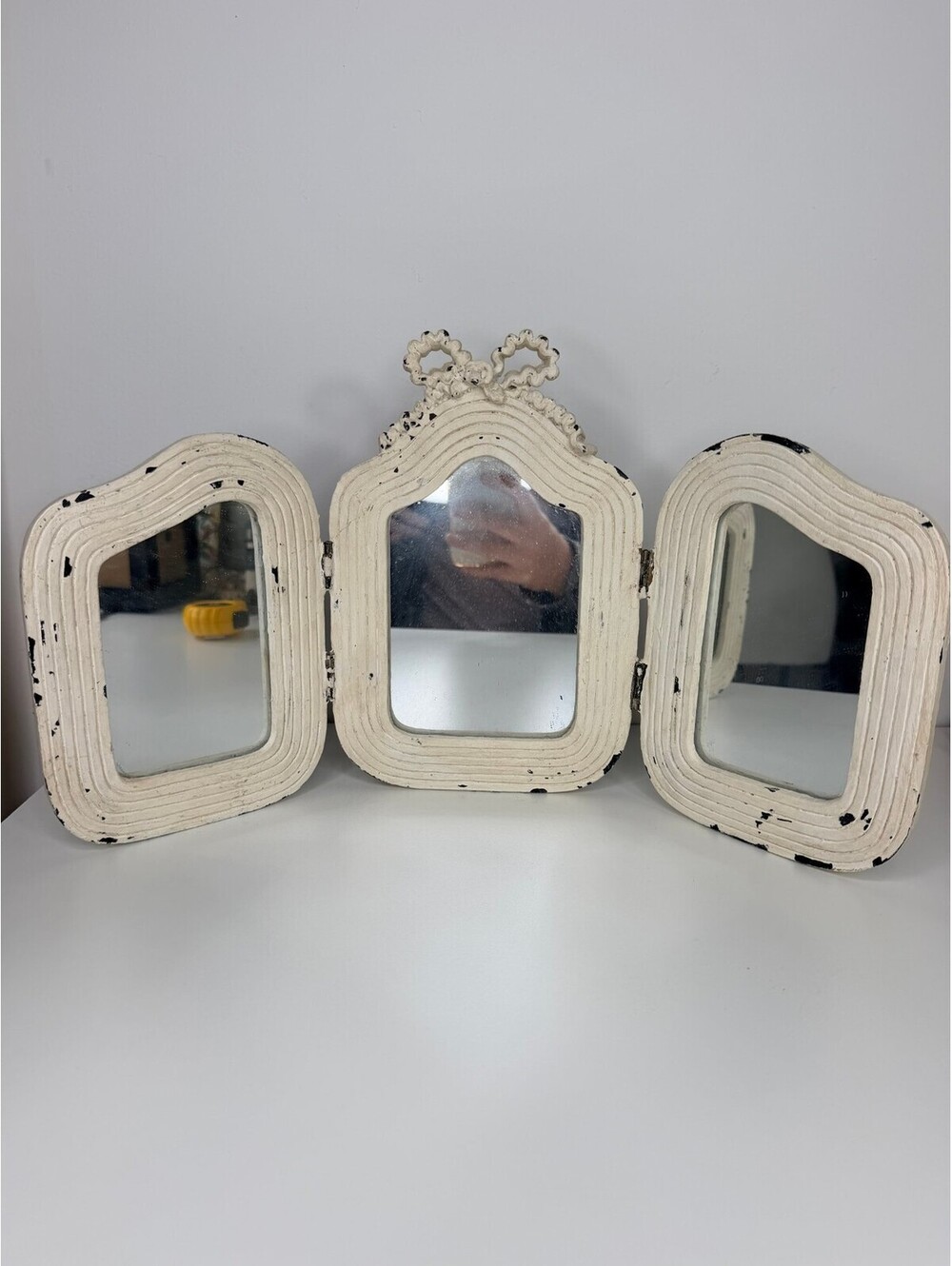 Trifold vanity mirror with bow top distressed white frame
